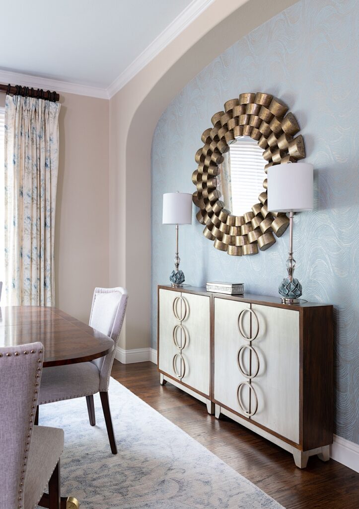A mirror above a cabinet. Storage is essential in a dining room and there are many sizes of cabinetry on the market to fit most spaces.